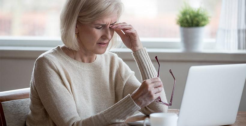 Older woman having a headache