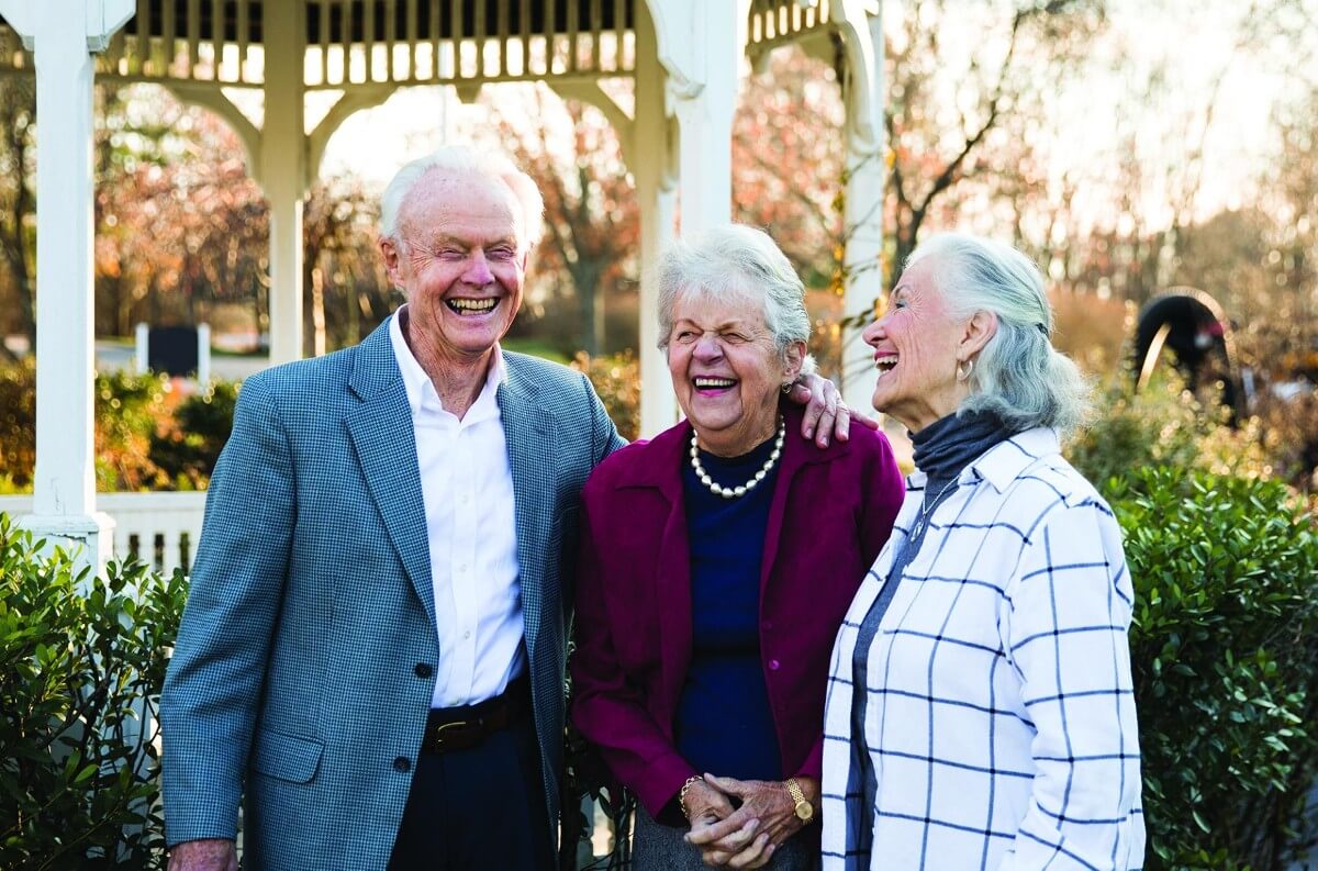 Seniors laughing outdoors