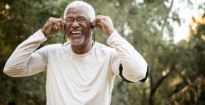 Senior man listening to music on headphones