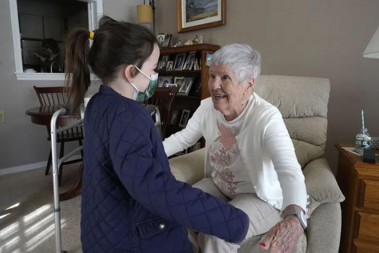Granddaughter hugging grandmother