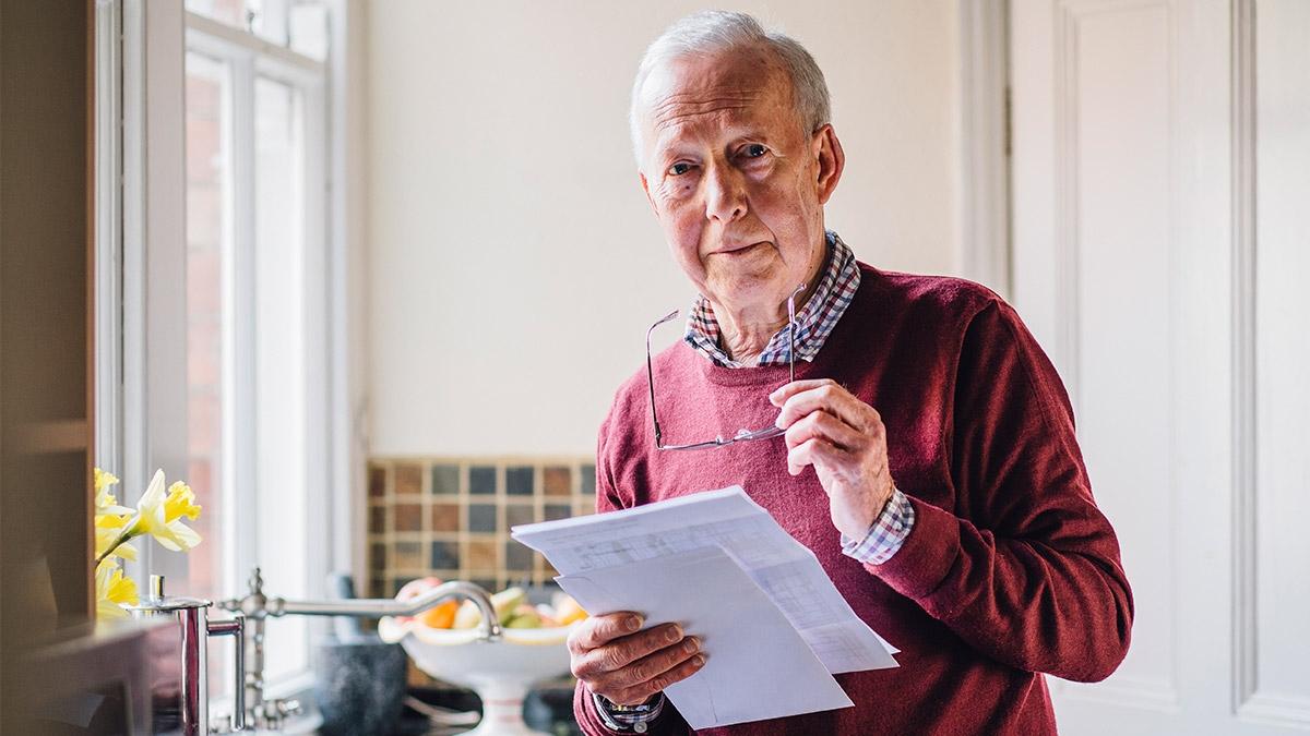 Senior man looking at papers