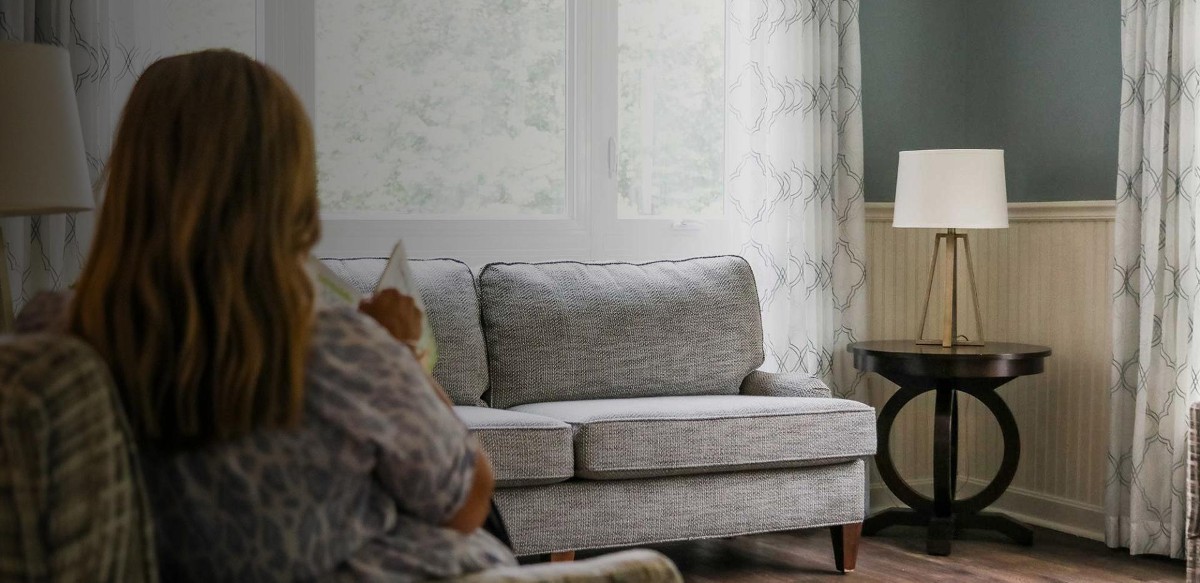 Woman sitting on couch