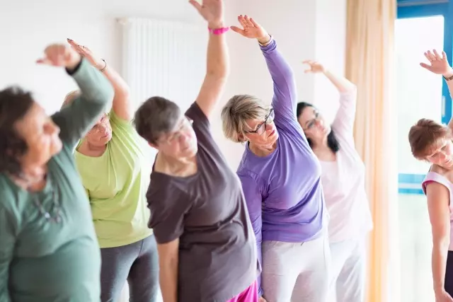 Senior women in yoga class