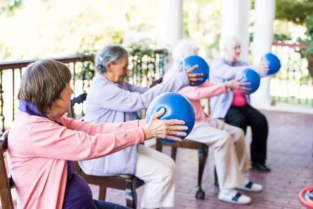 Seniors in outdoor yoga class